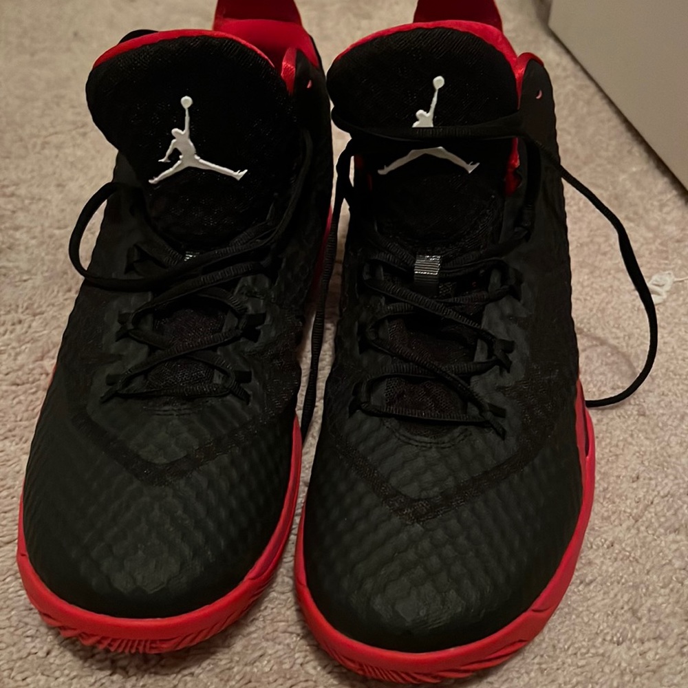Red and black men’s Jordan never worn